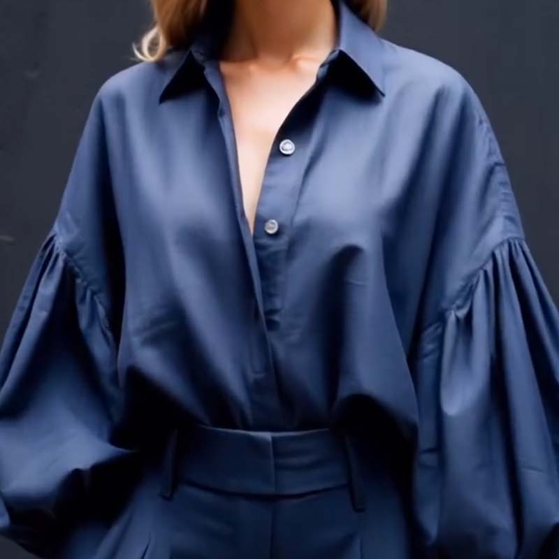 Ühevärviline reväär, pikkade varrukatega avara särgi ja vabaaja laiade pükste komplekt